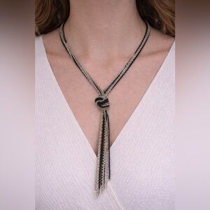 Multi strand metallic beaded necklace with knot detail